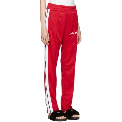 Shop Palm Angels Red Contrast Tape Track Pants