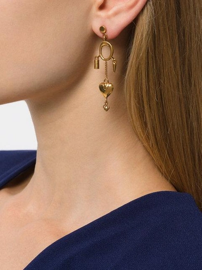 Shop Chloé Collected Hearts Charm Earrings - Metallic