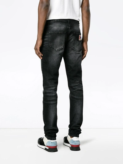 Shop Saint Laurent Washed Slim-fit Jeans In Black