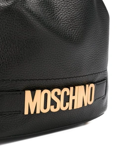 Shop Moschino Drawstring Logo Shoulder Bag - Black