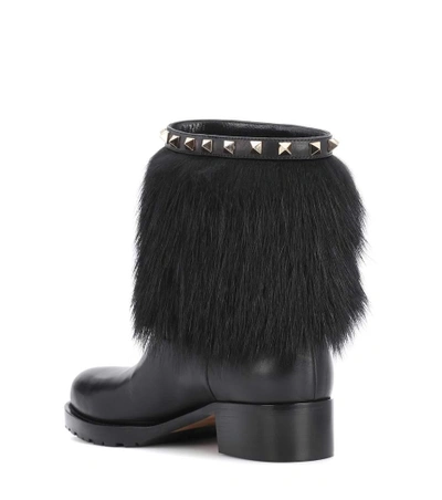 Shop Valentino Rockstud Winter Leather Boots In Black