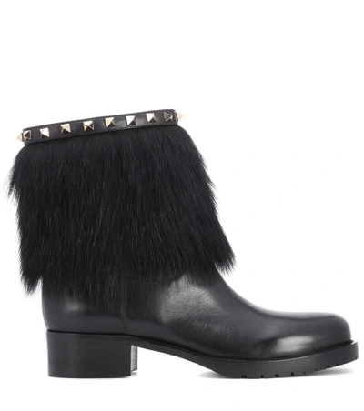 Shop Valentino Rockstud Winter Leather Boots In Black