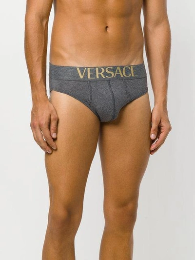 Shop Versace Pack Of Three Logo Waistband Briefs In Black