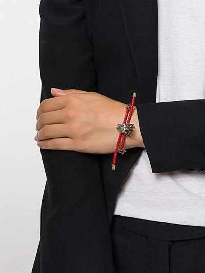 Shop Alexander Mcqueen Skull Braided Bracelet In Red