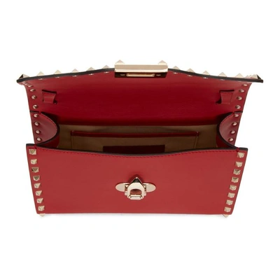 Shop Valentino Red  Garavani Medium Rockstud Flap Bag