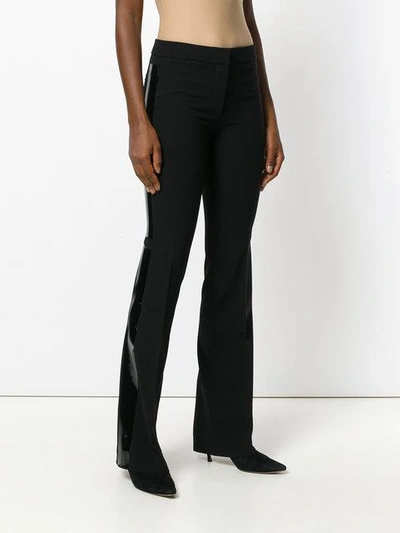 Shop Moschino Flared Trousers - Black