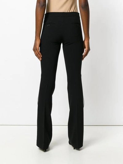 Shop Moschino Flared Trousers - Black