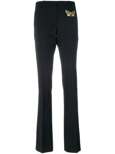 Shop Gucci Moth Embroidered Skinny Flared Trousers In Black