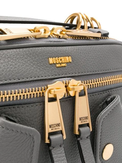 Shop Moschino Small Logo Embossed Shoulder Bag In Grey
