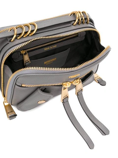 Shop Moschino Small Logo Embossed Shoulder Bag In Grey