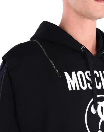 Shop Moschino Hooded Sweatshirts In Black