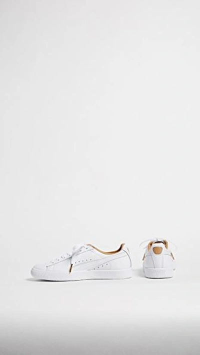 Shop Puma Clyde Core Leather Sneakers In White