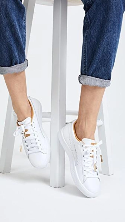 Shop Puma Clyde Core Leather Sneakers In White