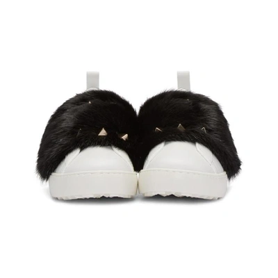 Shop Valentino White  Garavani Fur Laceless Rockstud Sneakers In A01 Black