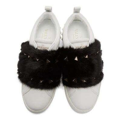 Shop Valentino White  Garavani Fur Laceless Rockstud Sneakers In A01 Black