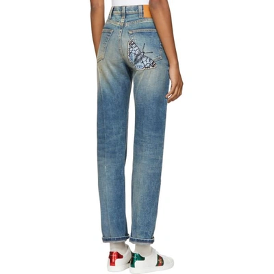 Shop Gucci Blue Butterfly Appliqué Jeans