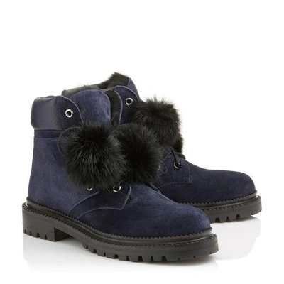 Shop Jimmy Choo Elba Flat Navy Suede Boots With Fur Pom Poms