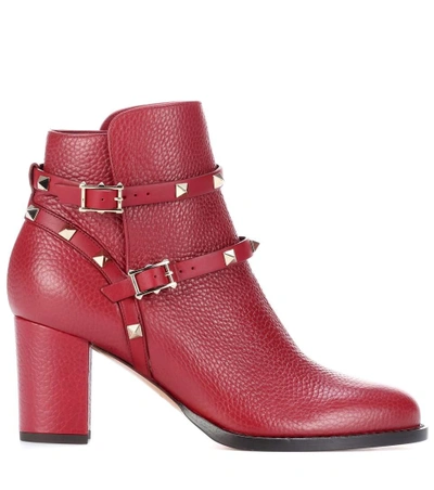 Shop Valentino Rockstud Leather Ankle Boots In Red