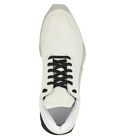 Shop Adidas Originals Ro Level Runner Leather Sneakers In Milk Black