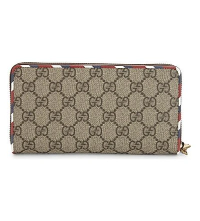 Shop Gucci Courier Supreme Gg Wallet In Tan