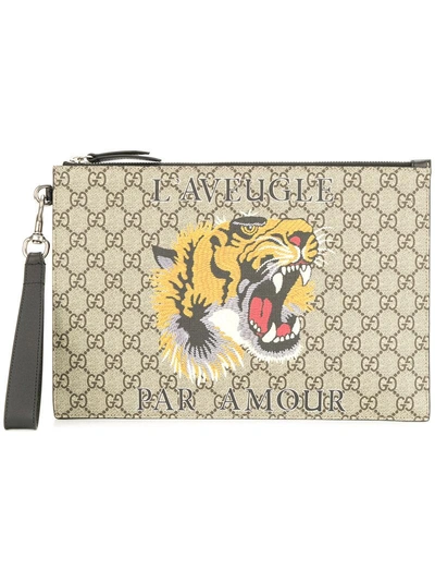 Shop Gucci Gg Supreme Pouch With Print - Brown
