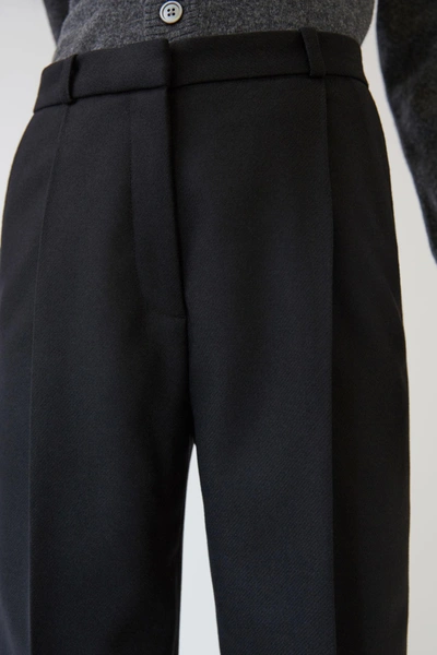 Shop Acne Studios Cropped Flannel Trousers Black