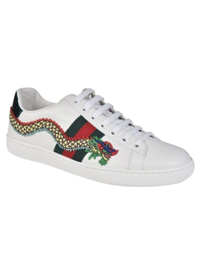 Shop Gucci Dragon Sneakers In White