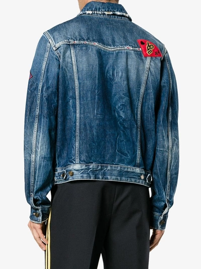 Shop Saint Laurent Multi-patch Distressed Denim Jacket In Blue