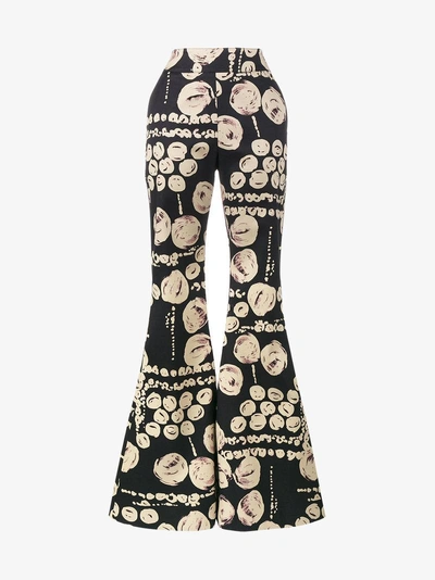 Shop Beaufille Cyrus Printed Flared Trousers In Black