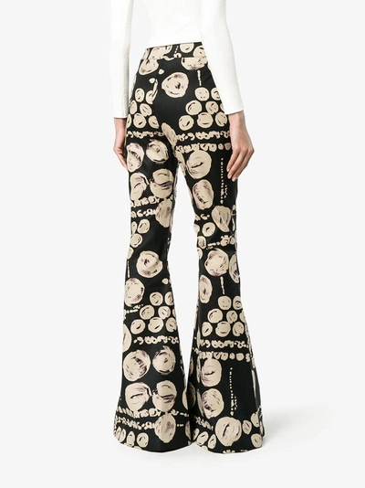 Shop Beaufille Cyrus Printed Flared Trousers In Black