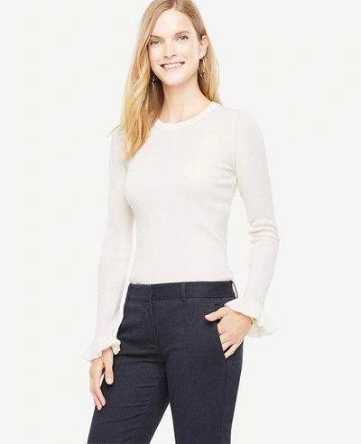 Shop Ann Taylor Extrafine Merino Wool Ruffle Cuff Sweater In Winter White