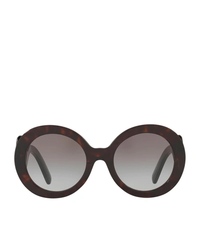 Shop Prada Round Sunglasses In Tortoiseshell