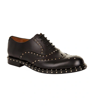 Shop Valentino Leather Rockstud Brogues In Black
