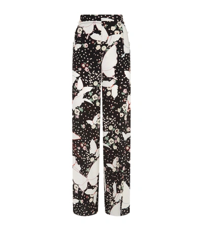 Shop Valentino Floral Print Trousers In Black