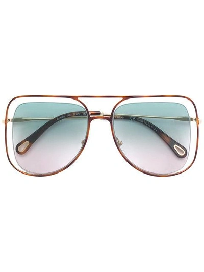 Shop Chloé Floating Frame Sunglasses In Brown