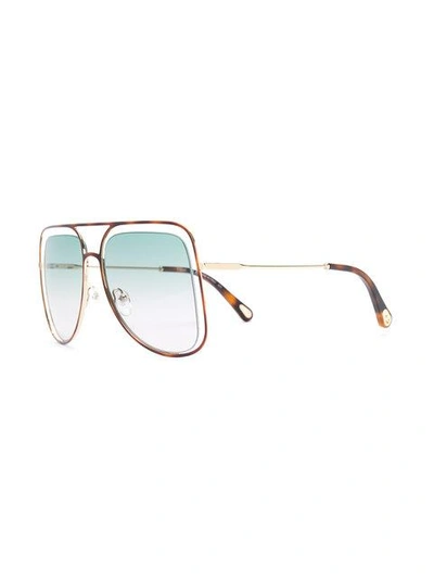 Shop Chloé Floating Frame Sunglasses In Brown