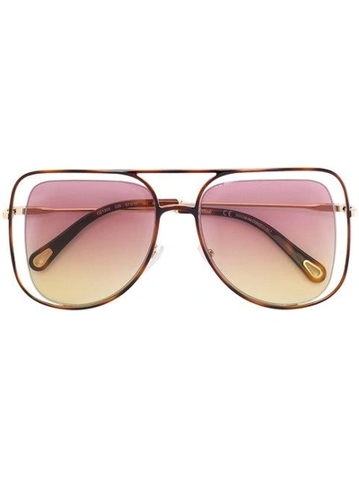 Shop Chloé Floating Frame Sunglasses In Metallic