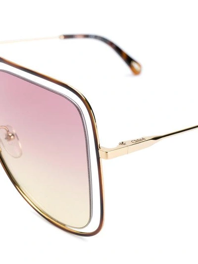 Shop Chloé Floating Frame Sunglasses In Metallic