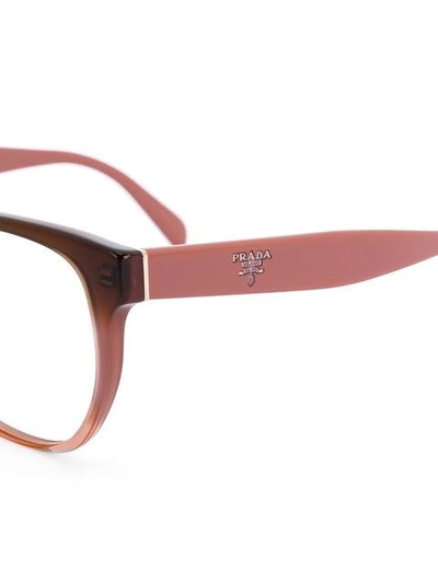 Shop Prada Eyewear Two Tone Rounded Frame Glasses - Pink