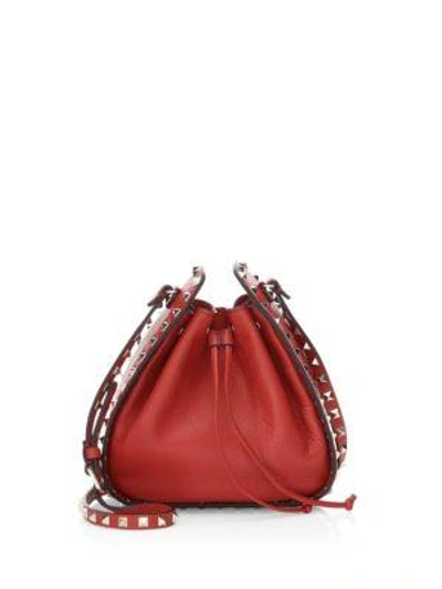 Shop Valentino Small Rockstud Leather Bucket Bag In Red