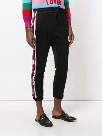 Swarovski crystal-embellished striped track pants