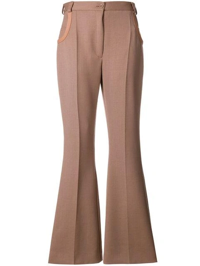 Shop Nina Ricci Leather-trimmed Flared Trousers - Pink