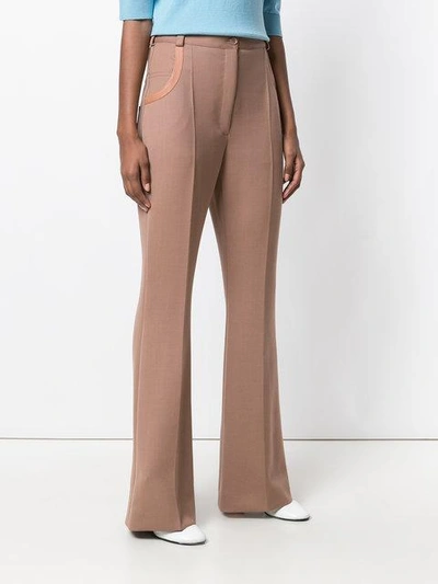 Shop Nina Ricci Leather-trimmed Flared Trousers - Pink