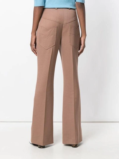 Shop Nina Ricci Leather-trimmed Flared Trousers - Pink