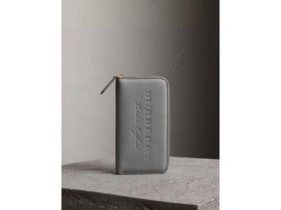 Shop Burberry Embossed Grainy Leather Ziparound Wallet In Dusty Teal Blue