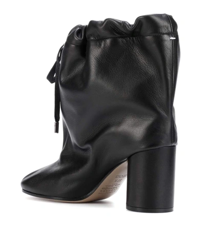 Shop Maison Margiela Oversized Leather Ankle Boots In Black