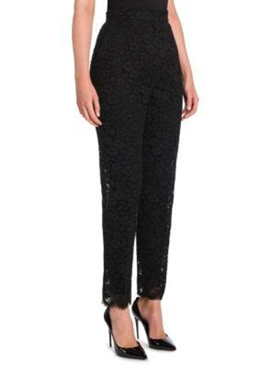 Shop Dolce & Gabbana Floral Lace Trousers In Black