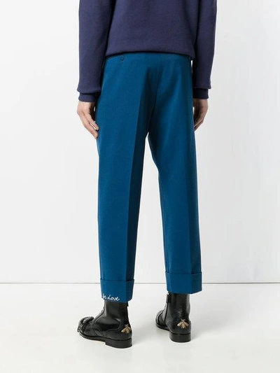 Shop Gucci Embroidered Ankle Cropped Trousers - Blue