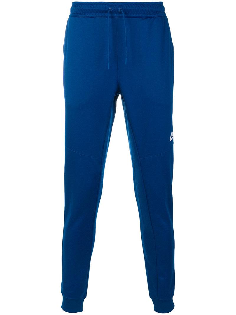 nike tribute track pants blue