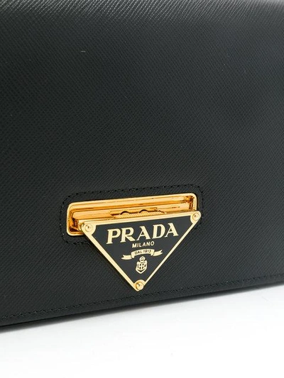 Shop Prada Saffiano Logo Clutch In Black